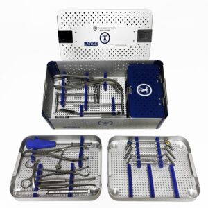 A set of surgical instruments in a metal box.